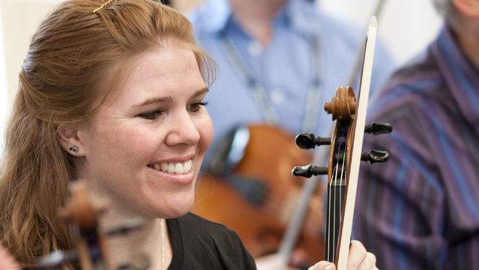 Young violinist laughing