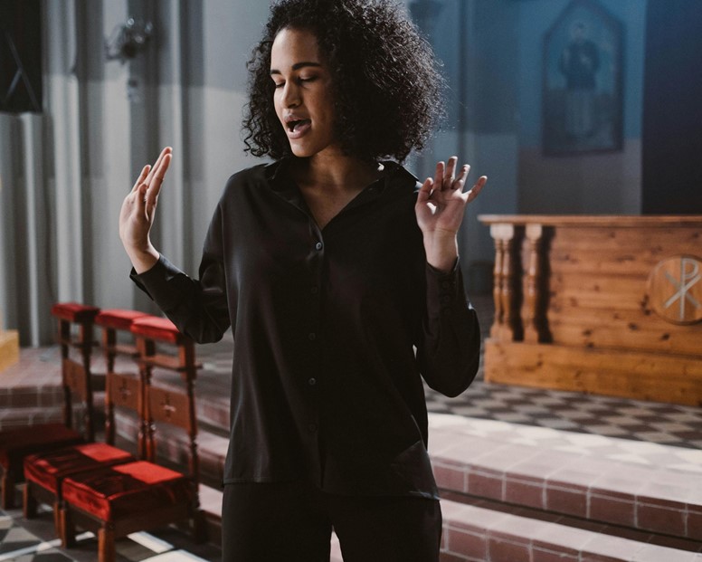 undefinedWoman singing in church